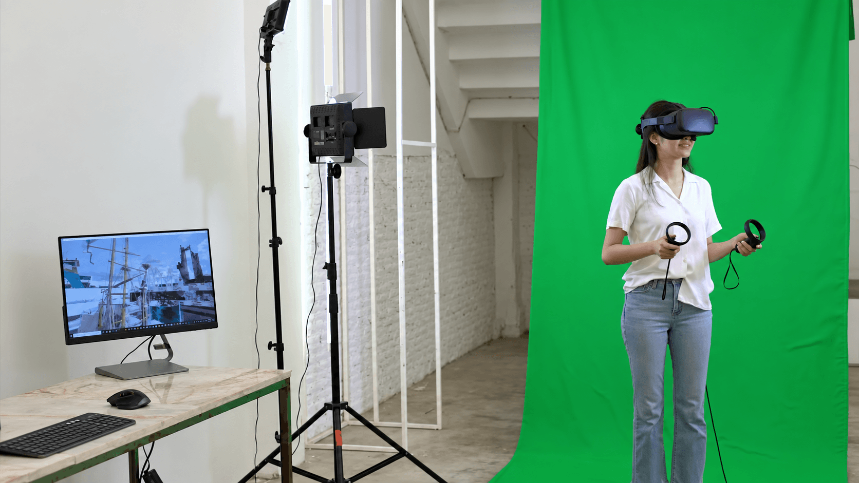 A participant using a VR headset and controllers beside a monitor at INDA Parade 2020. AI-enhanced video still.