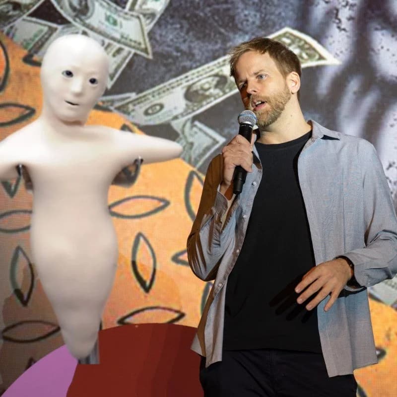 A playful composite of James Wood holding a microphone beside a Telenoid robot.