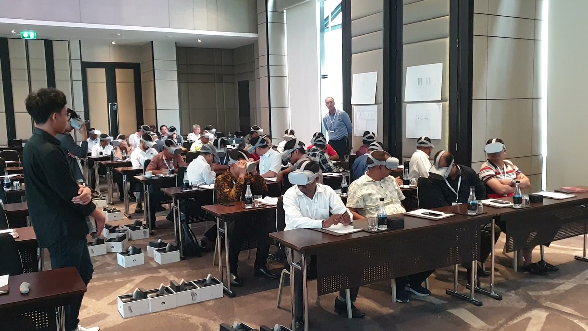 Aviagen seminar attendees wearing Oculus Go headsets during the group VR farm tour in Bangkok, November 2019.