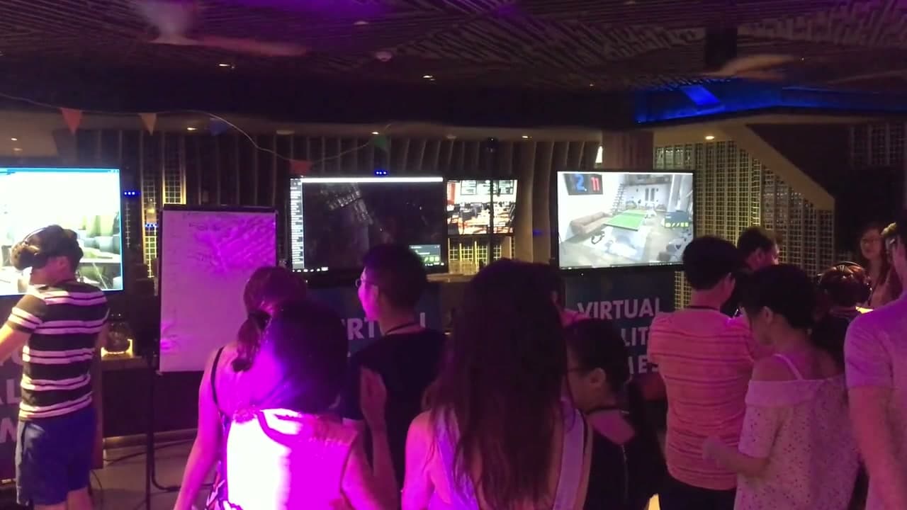 Bain & Company retreat guests trying the VR games and watching the display screens in Phuket, September 2017.