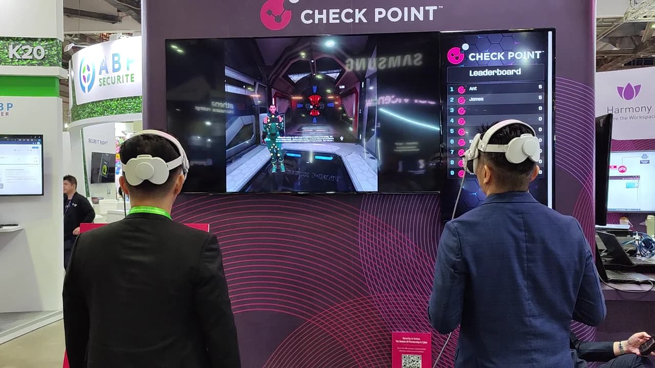 Visitors using VR headsets at the Check Point stand at GovWare Singapore 2024.