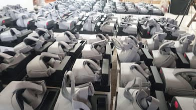 Rows of Oculus Go headsets arranged on boxes for GSK